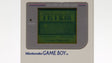 Game Boy clássico com o ecrã do Tetris ligado, um dos videojogos mais vendidos de sempre