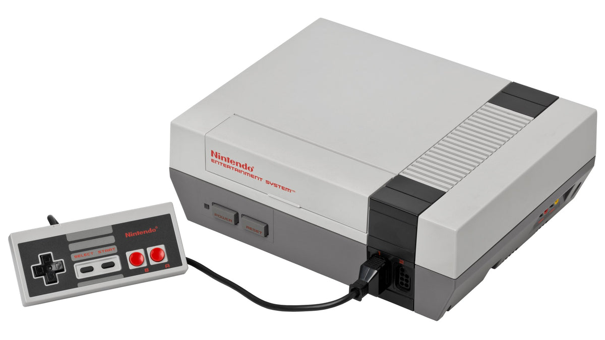 Consola Nintendo Entertainment System (NES) com comando, a plataforma onde nasceram os recordes de Super Mario